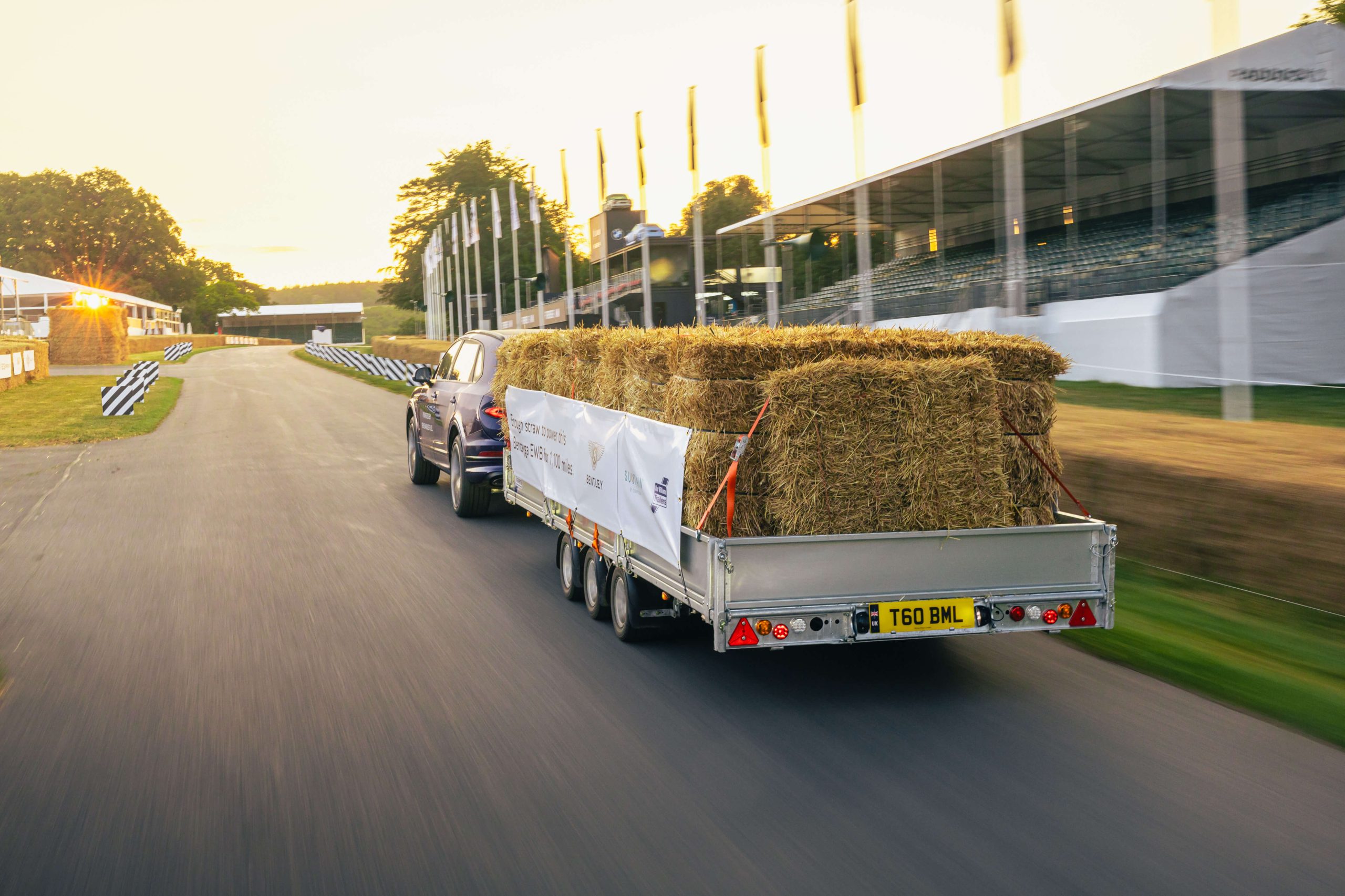 Bentley Bentyga with a trailer of hay on a racecourse, fuelled by SUSTAIN fuel